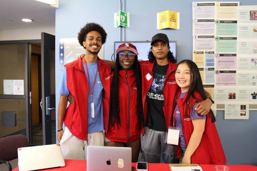 Four students standing together