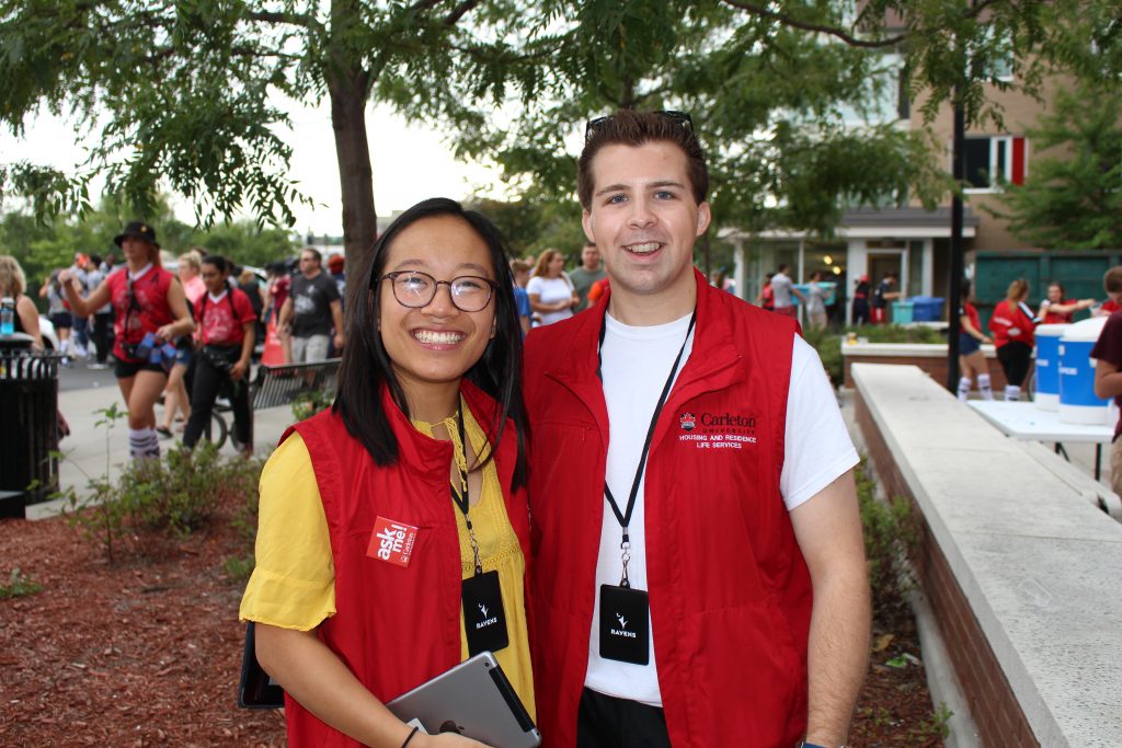 Two students wearing red jackets