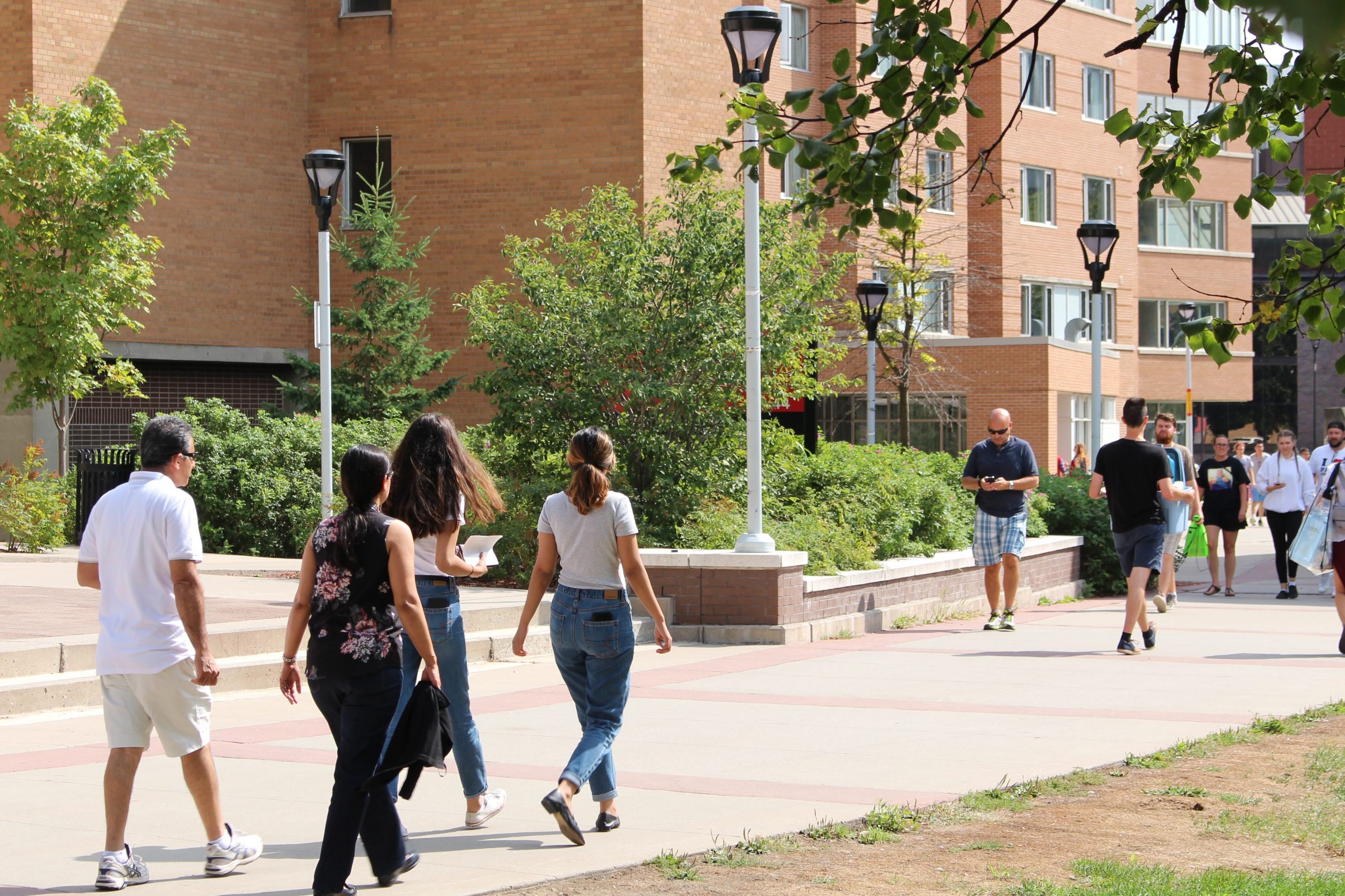 Students and parents walking through the academic quad