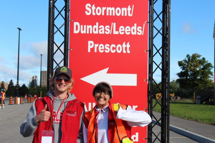 Two students showing their thumbs up