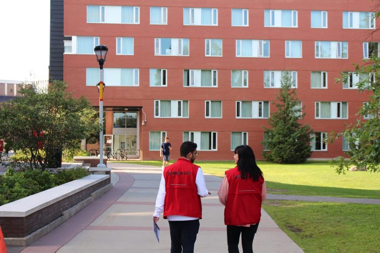 Two students walking on Carleton campus