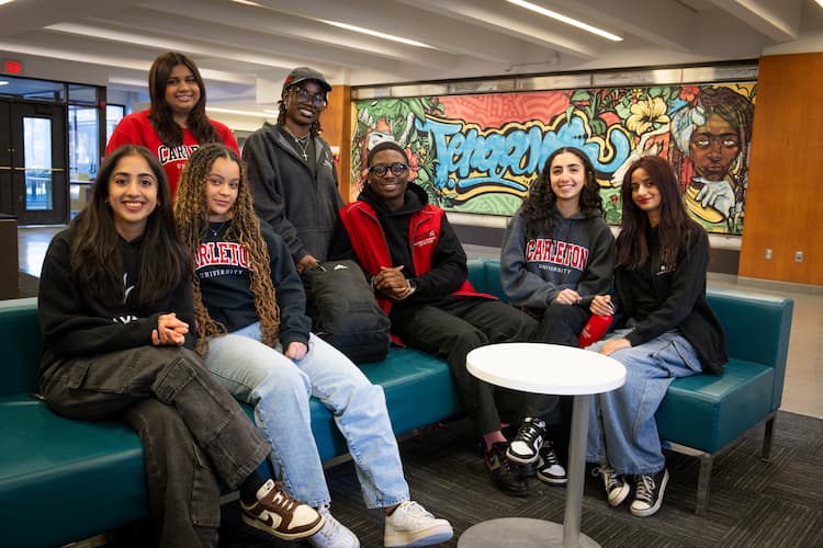 A group of Carleton students sitting in Teraanga Commons