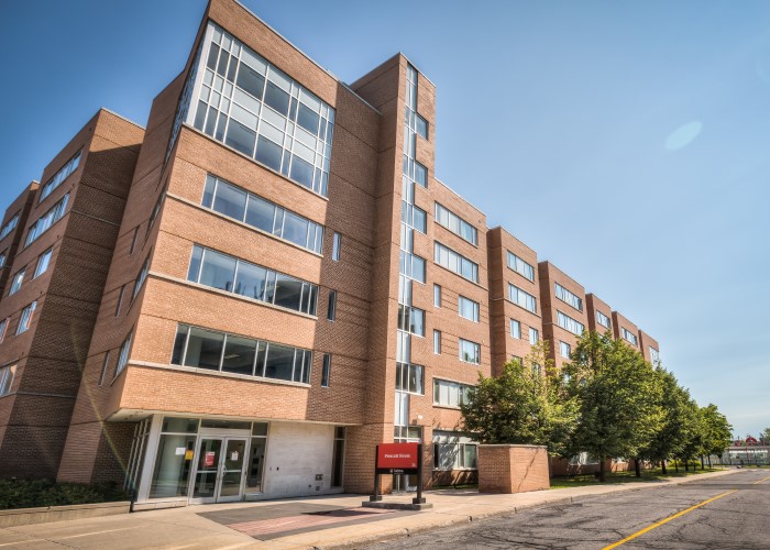 Prescott House. A brick residence building with large windows.