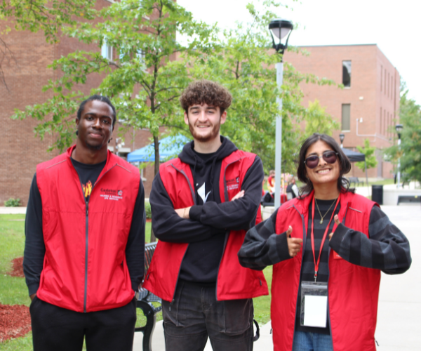 Three Carleton RAs pose in the academic quad